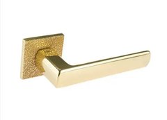 Дверная ручка Tupai 4161 5SQ/T3 33 золото полированное и матовое/кожа 44-7990 фото